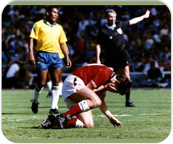 England footballer Gary Lineker reacts after miskicking his penalty