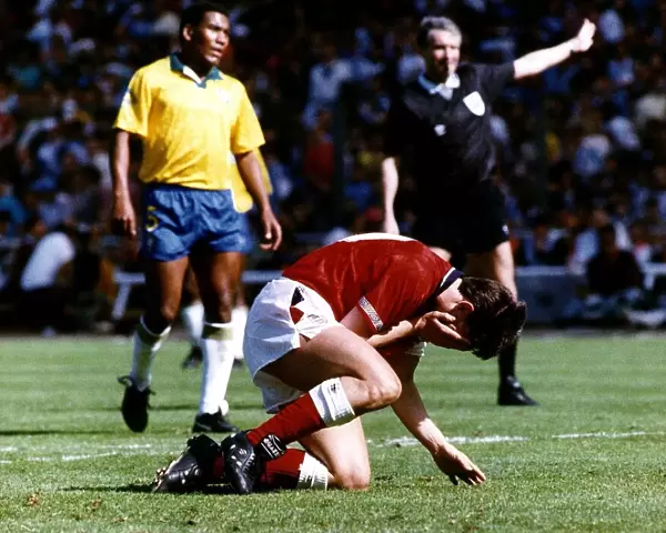 England footballer Gary Lineker reacts after miskicking his penalty