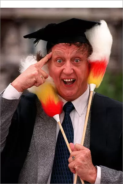 Ken Dodd comedian waring mortar board hat Ken Dodd after being made an honorary fellow