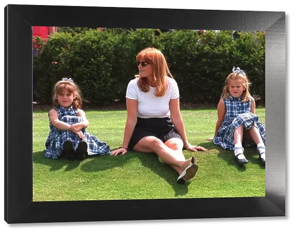 Duchess of York sits on the grass with Princess Eiugenie