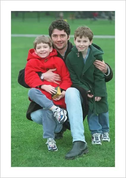 Dominic Taylor actor with his sons Arthur 6 in red coat and Jack 7 in green coat