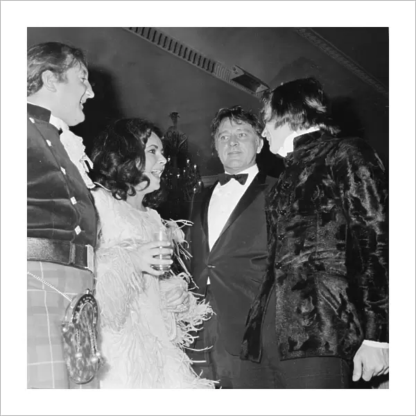 Elizabeth Taylor joking with Nureyev and Richard Burton March 1968