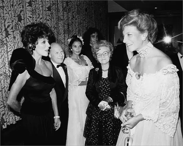 British actress Joan Collins meets the Princess of Kent at the Poppy Ball at
