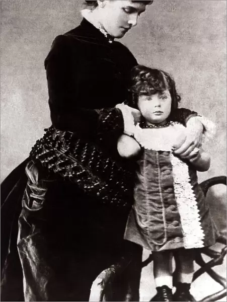 Sir Winston Churchill as a child - circa 1878, standing on a chair, wearing a dress