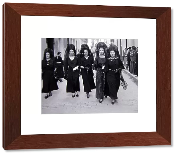 Four ladies of Seville, Spain wearing black dresses Circa 1935