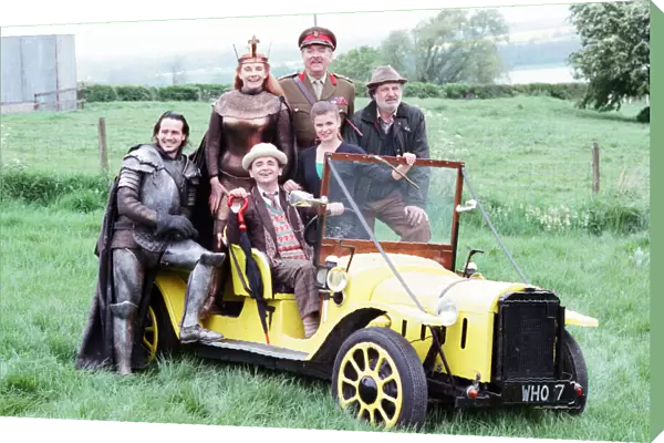 Sylvester McCoy as the Doctor behind the wheel, Christopher Bowen as Mordred