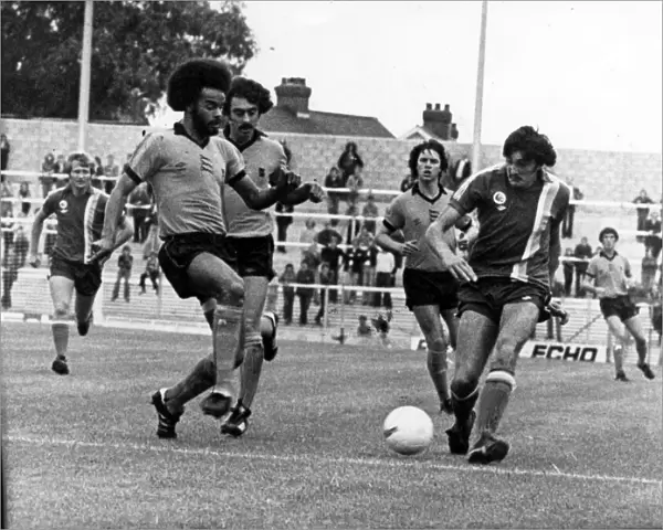 George Berry (left) moves in to challenge City striker Gary Stevens at Ninian Park - 10th
