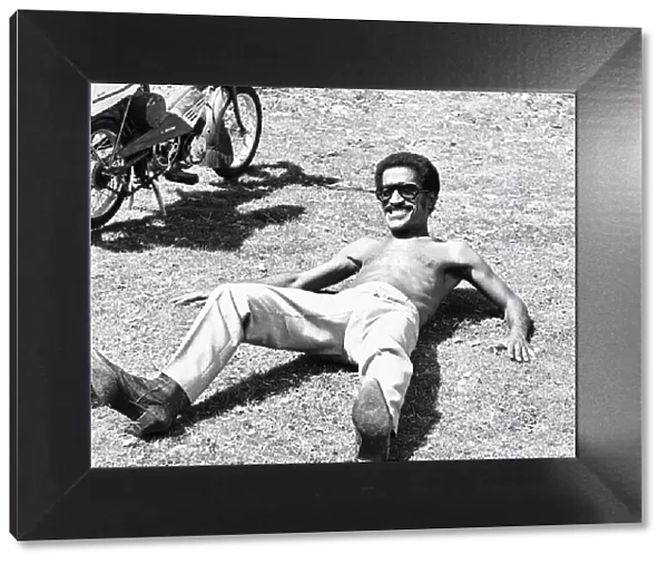 Sammy Davis Junoir seen here relaxing whilst on location at Eastnor Castle