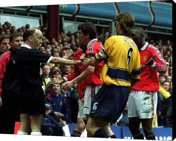 ROY KEANE IS RESTRAINED BY TONY ADAMS AFTER DISALLOWED GOAL FOR OFFSIDE IN THE FA CUP