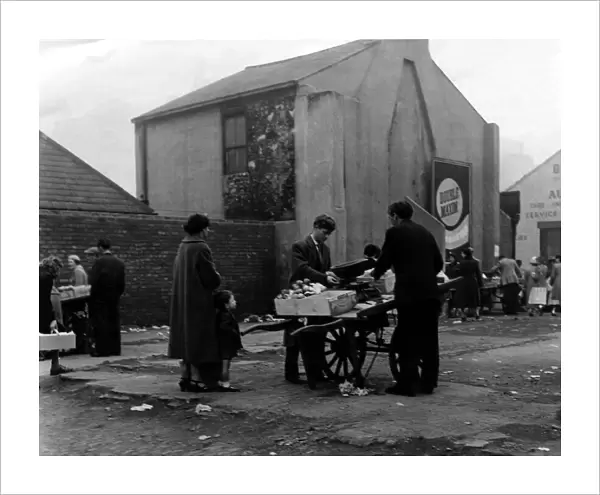 Barrow boys carry on trading at the Broughton Street site on 7th July 1958