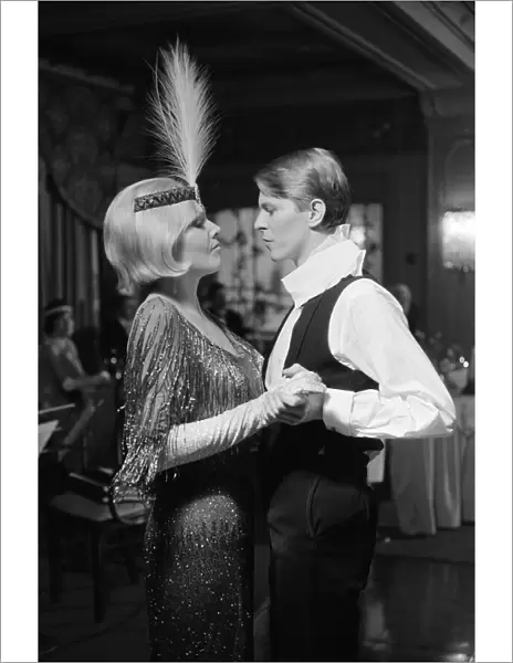 British pop singer David Bowie and actress Kim Novak pictured in a scene from their