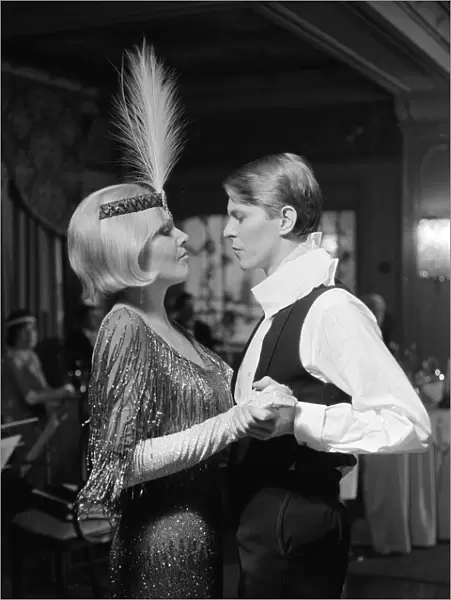 British pop singer David Bowie and actress Kim Novak pictured in a scene from their