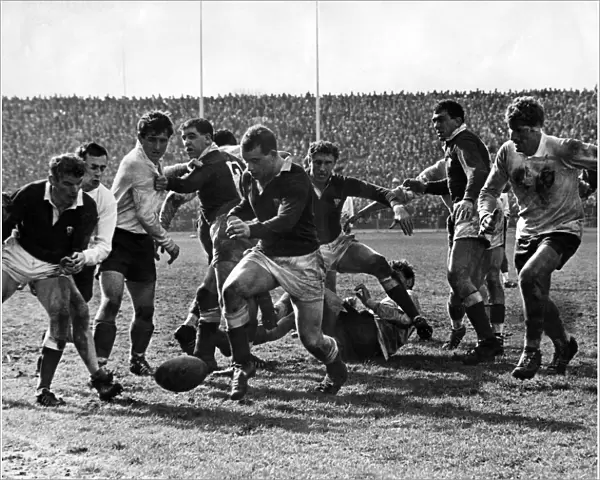 Wales v France rugby match. Welsh forward John Lloyd dribbling the ball in the loose
