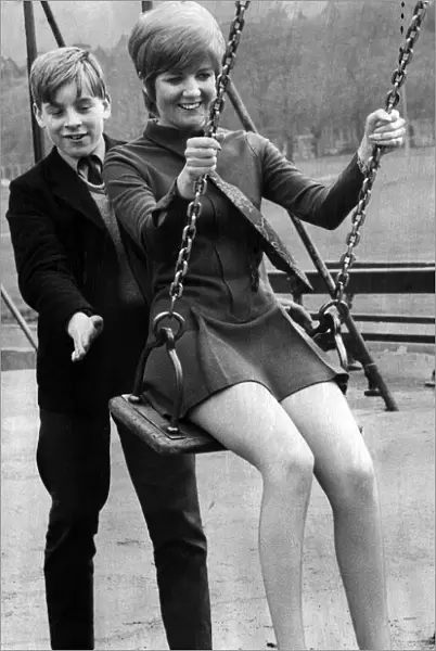 Cilla Black, singer, couldn t resist having a swing as she strolled past a