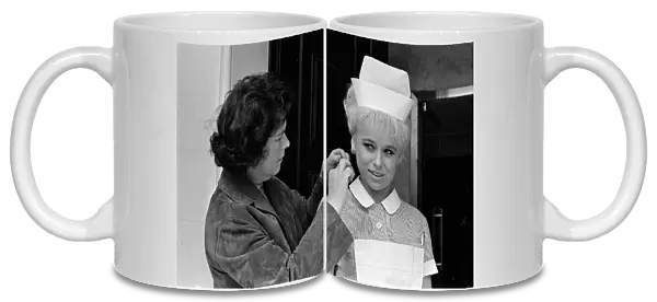 Barbara Windsor (right) having her hair sorted on the film set of Carry On Doctor