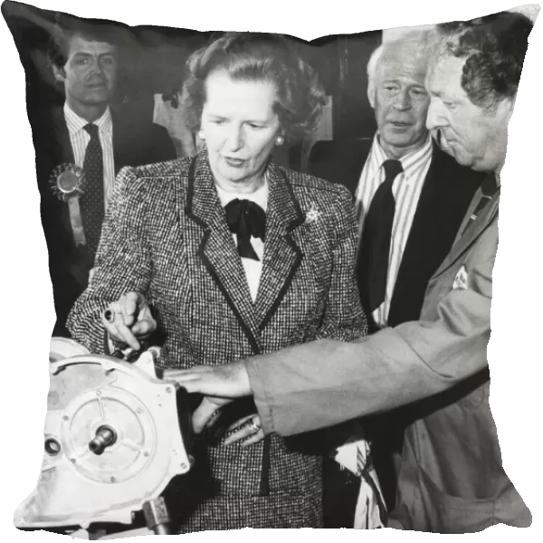 Baronnes Margaret Thatcher accompanied by Patrick Nicholls (left
