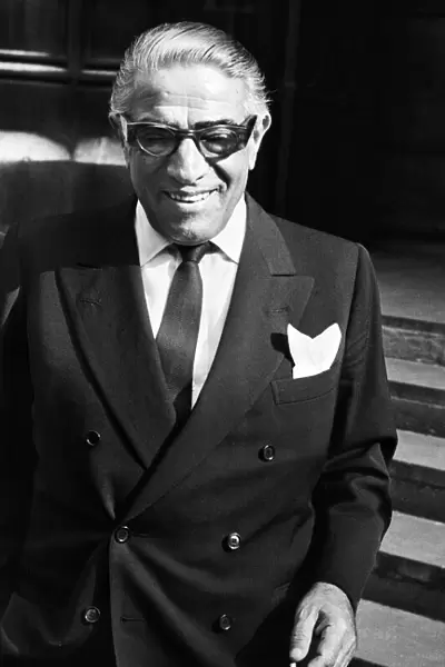 Greek shipping tycoon Aristotle Onassis attends the Law Courts in London to sue 77 year