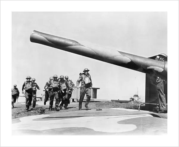 Soldiers manning one of the thousands of coastal defence guns against possible German