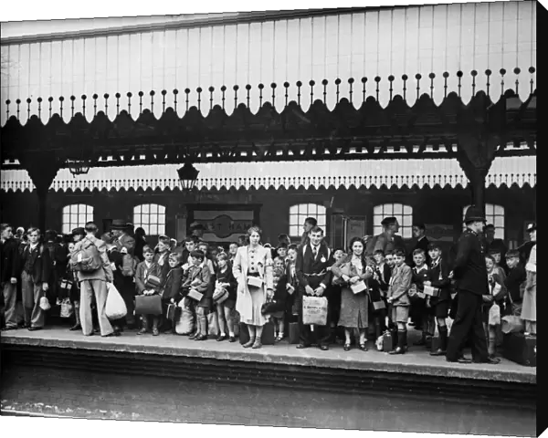 Children wait on the platform of East Ham railway station waiting for evacuation to