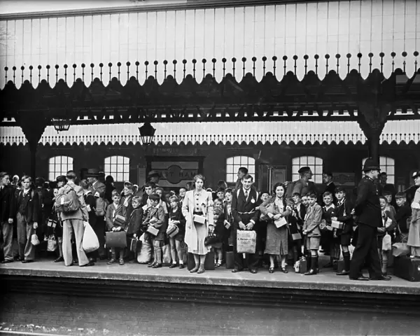 Children wait on the platform of East Ham railway station waiting for evacuation to