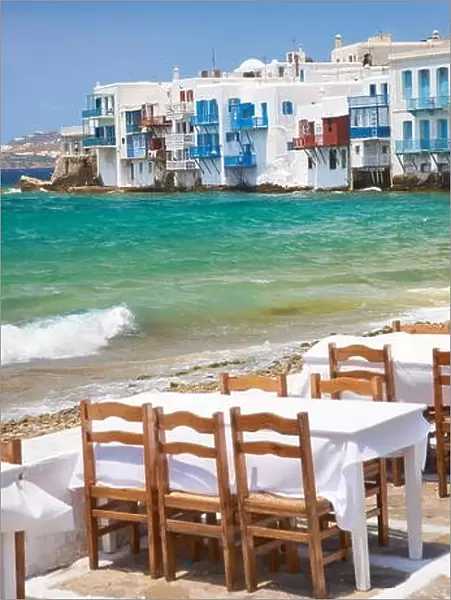 Cafe restaurant in Mykonos Town, Chora, Little Venice in the background - Mykonos Island, Cyclades, Greece