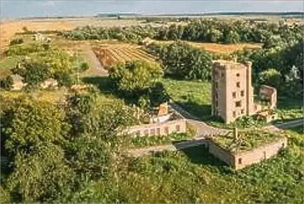Aerial View Remains Of Yastrzhembsky Estate And Park Complex. Top View Of Old Five-storey Brick Water Tower. Drone View Of Beautiful European Nature