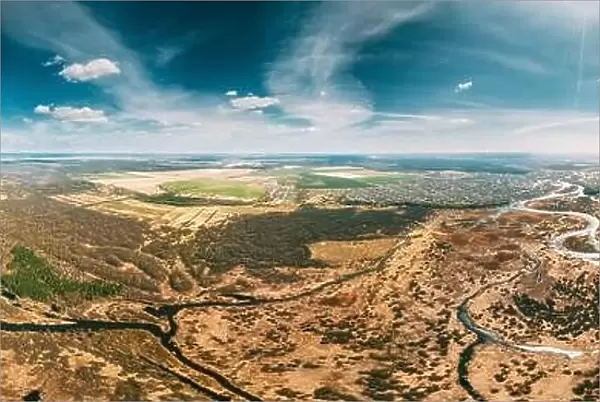 Aerial View Curved River In Early Spring Landscape. Top View Of Beautiful European Nature From High Attitude. Drone View. Bird's Eye View. Little Smal