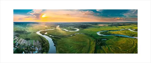 Aerial View Green Forest Woods Meadow And River Landscape In Sunny Spring Evening. Top View Of Beautiful European Nature From High Attitude In Summer