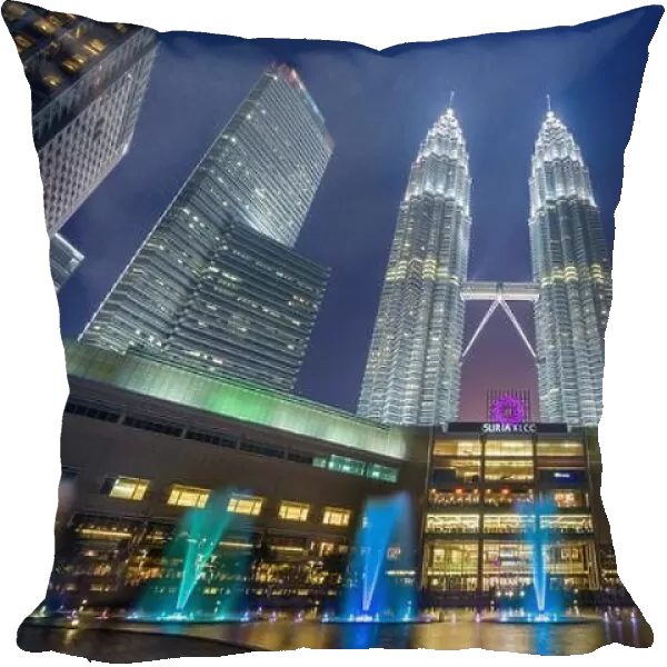 KUALA LUMPUR - SEPTEMBER 14, 2015: The Petronas Towers viewed from KLCC Park at twilight