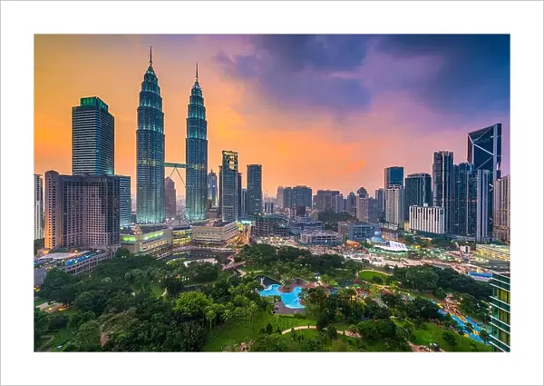 Kuala Lumpur, Malaysia skyline at dusk over the park