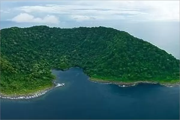 Rainforest covers the remote Mary Island which is fringed by a coral reef in the Solomon Islands. This country is home to amazing marine biodiversity