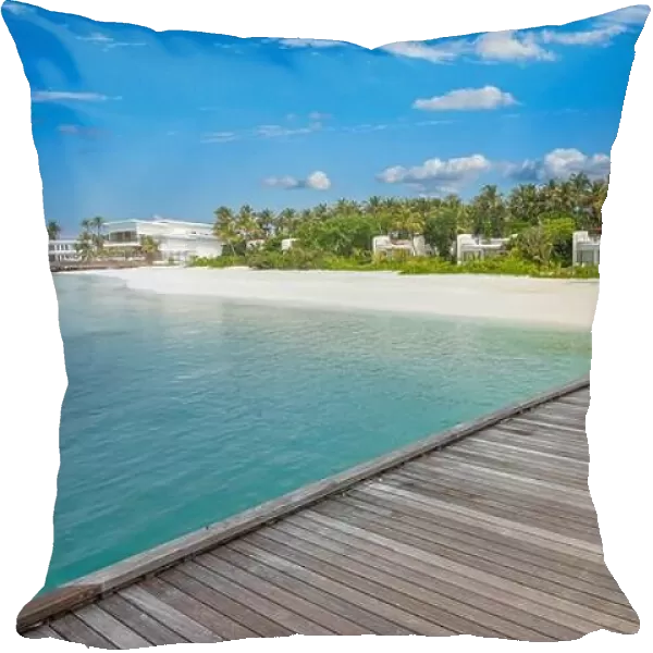 Beautiful tropical Maldives resort hotel and island shore with beach and sea sky for holiday vacation background concept. Jetty into island paradise
