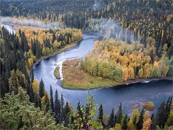 Scenic river landscape with fall colors woodland at autumn morning in National Park, Finland