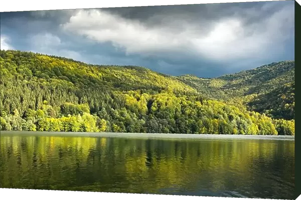 Picturesque landscape with clear lake and autumn forest on his coast. Tereblia-Ritske Reservoir (Vilshanske) on Tereblia river