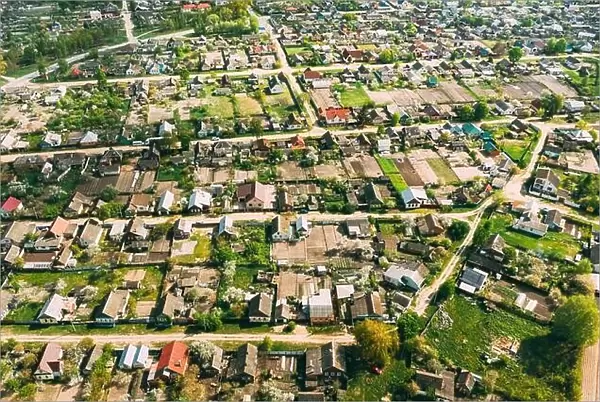 Belarus, Europe. Aerial View Of Small Town, Village Cityscape Skyline In Summer Day. Residential District, Houses And Vegetable Garden Beds In Bird's