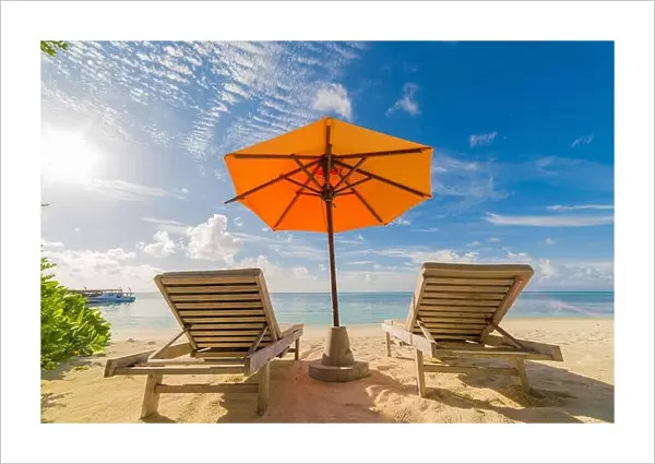 Vacation in tropical countries. Beach chairs, umbrella and palms on the beach
