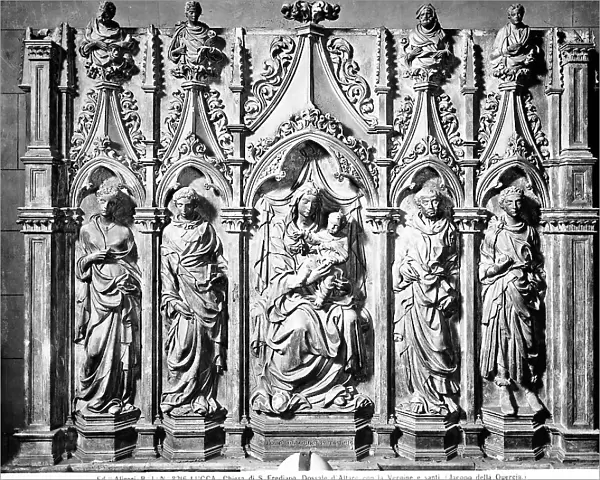 Poliptych representing the Virgin and four saints, sculpture by Jacopo della Quercia preserved in the Chapel of Trenta in the Church of St. Frediano, Lucca