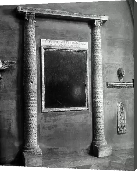 Columns and inscriptions found in Roman ruins, preserved along the walls in the cloister of the Basilica of S. Giovanni in Laterano, Rome