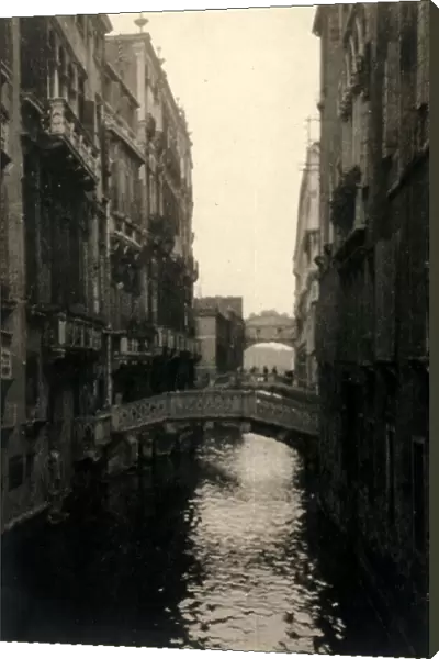 View of the Canonica Canal in Venice. The Bridge of Sighs is in the background