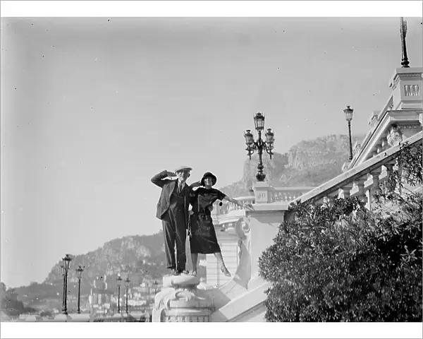 Portrait of a couple posing on a flight of steps on the seafront of Montecarlo