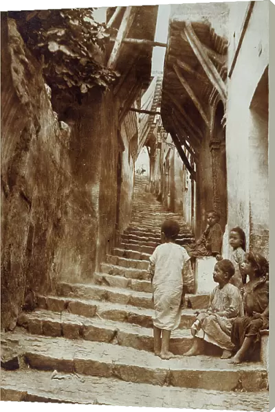 Group of children sitting on a stairway, Algeria