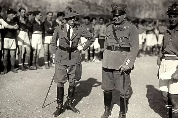Gabriele D'Annunzio and a high army officer pose together with the soldiers, who wear a sport uniform. The image was taken during the city occupation of Fiume by part of the Italian legionary troops, headed by Gabriele D'Annunzio
