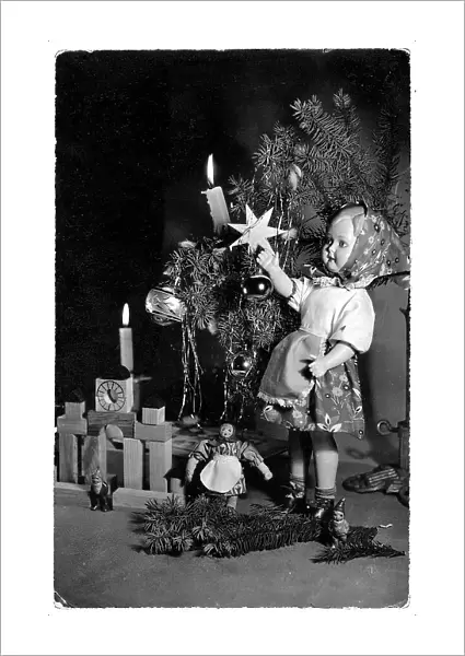 Doll and other toys under a little Christmas tree, Christmas greeting post-card, on the back side a personal dedication and the dispatch date 29th of December 1959, Poland