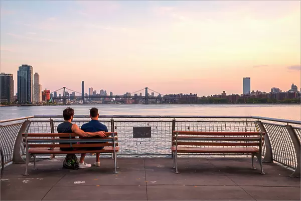 New York City, couple admiring view from WNYC Transmitter Park located in the Greenpoint neighborhood of Brooklyn