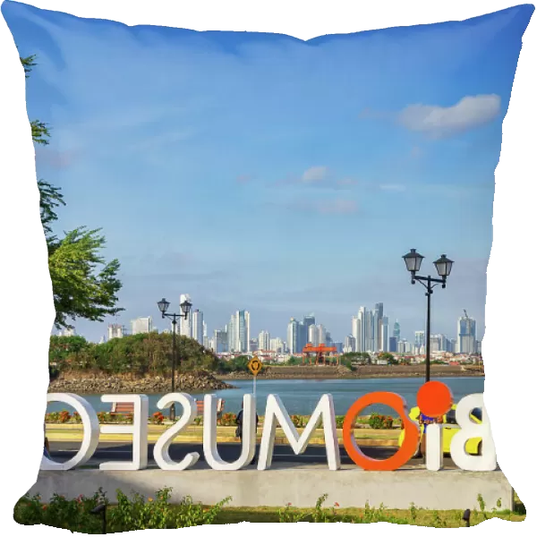 Panama, Panama City, Amador Causeway, Biomuseo sign with view of city skyline in the background