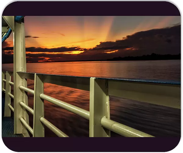 Brazil, sunset seen from ferry boat deck on Amazon river