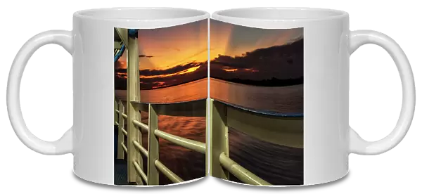 Brazil, sunset seen from ferry boat deck on Amazon river