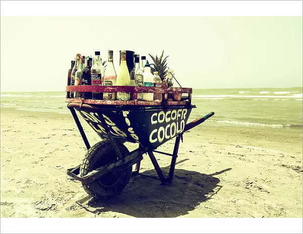 Colombia, Cartagena, Mobile bar in wheelbarrow on beach