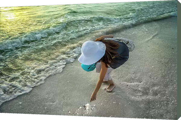 Florida, Marco Island, Beach, woman beachcombing