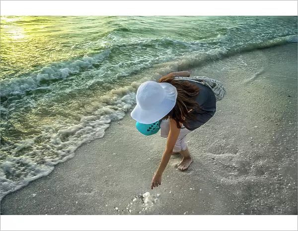 Florida, Marco Island, Beach, woman beachcombing